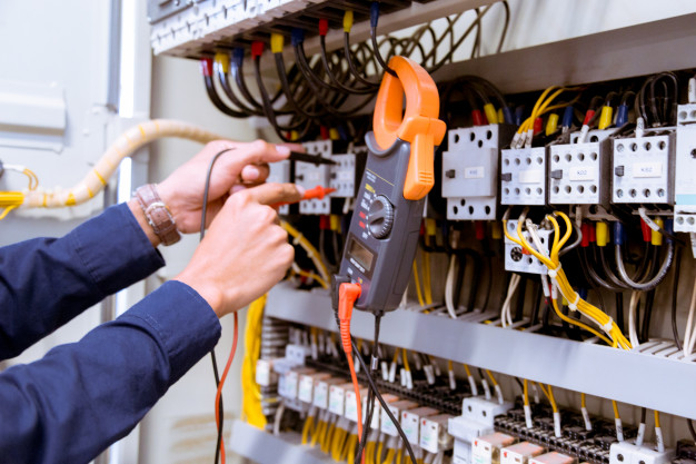 Electrician Testing Electric Current Control Panel 34936 2970